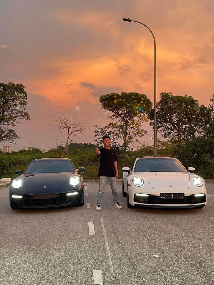 Eden with two Porsche 911s at sunset